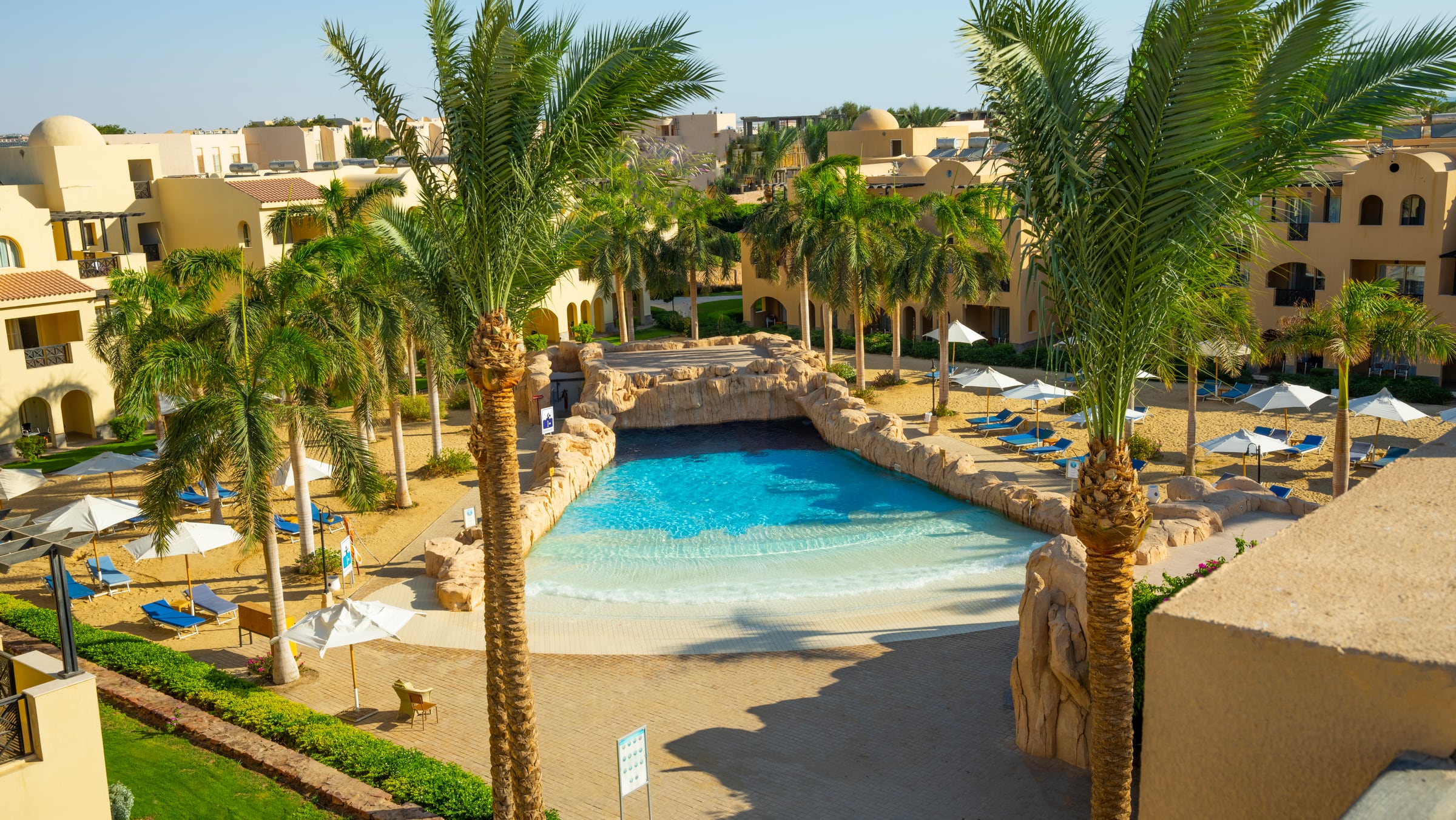 Palm-lined pools at Stella Gardens Resort & Spa